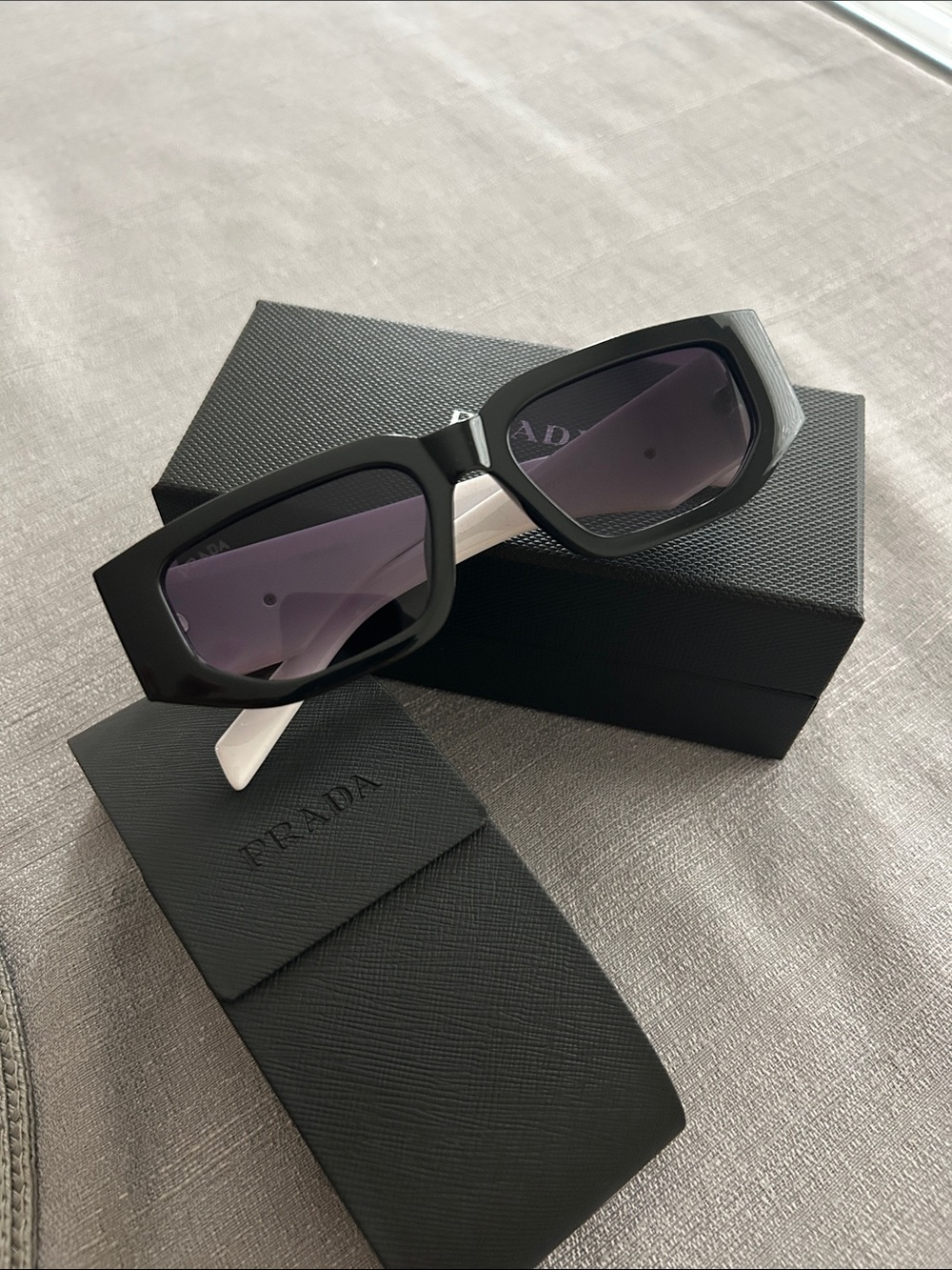 Prada Black Frame Sunglasses with Purple Lenses